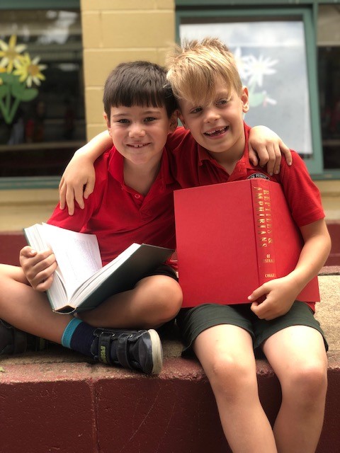 Photo of boys reading together
